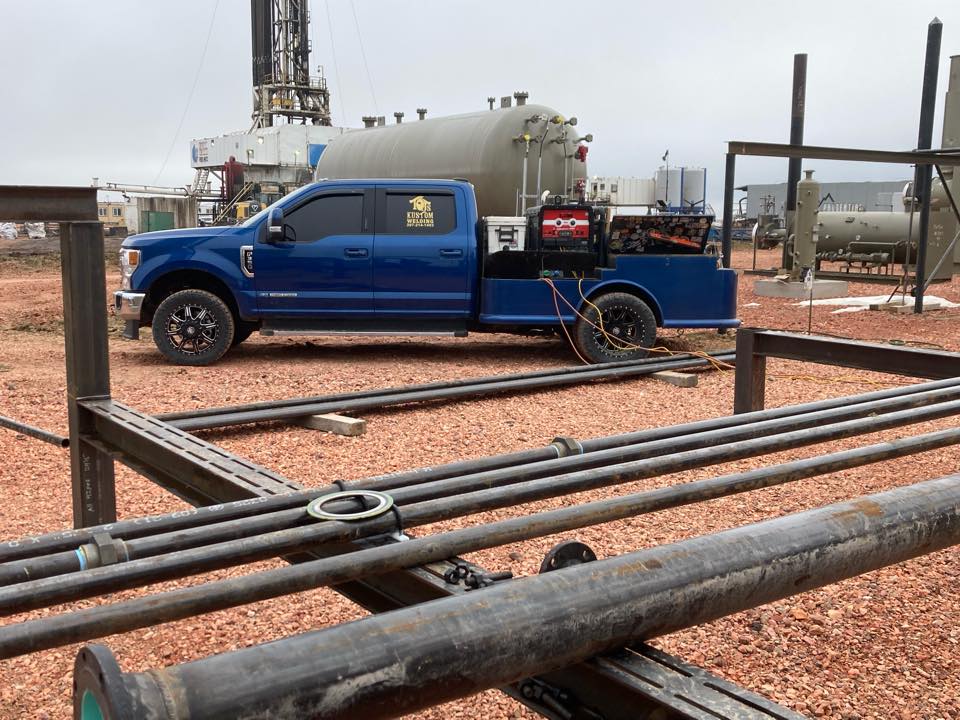 TJ's Kustom Welding truck on job site